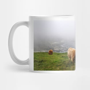 Highland cows on the misty coast of Islay, Scotland Mug